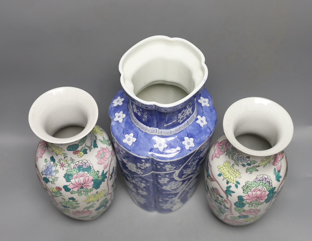 A pair of Chinese enamelled porcelain baluster vases and a Chinese blue and white vase. 37cm